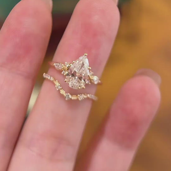 Video of lab-grown diamond pear bridal stacking ring for bridal ring stacks