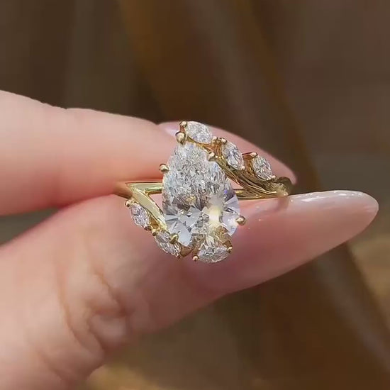 Video of lab-grown diamond pear wheat engagement ring for romantic proposals