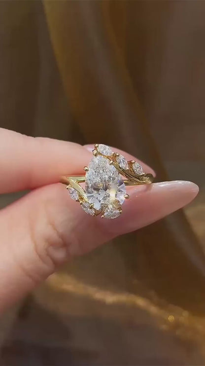 Video of lab-grown diamond pear wheat engagement ring for romantic proposals