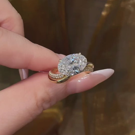 Video of lab-grown diamond oval twist engagement ring for modern proposals