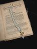 Video view of orb motif high-lustre freshwater pearl necklace styled for weddings