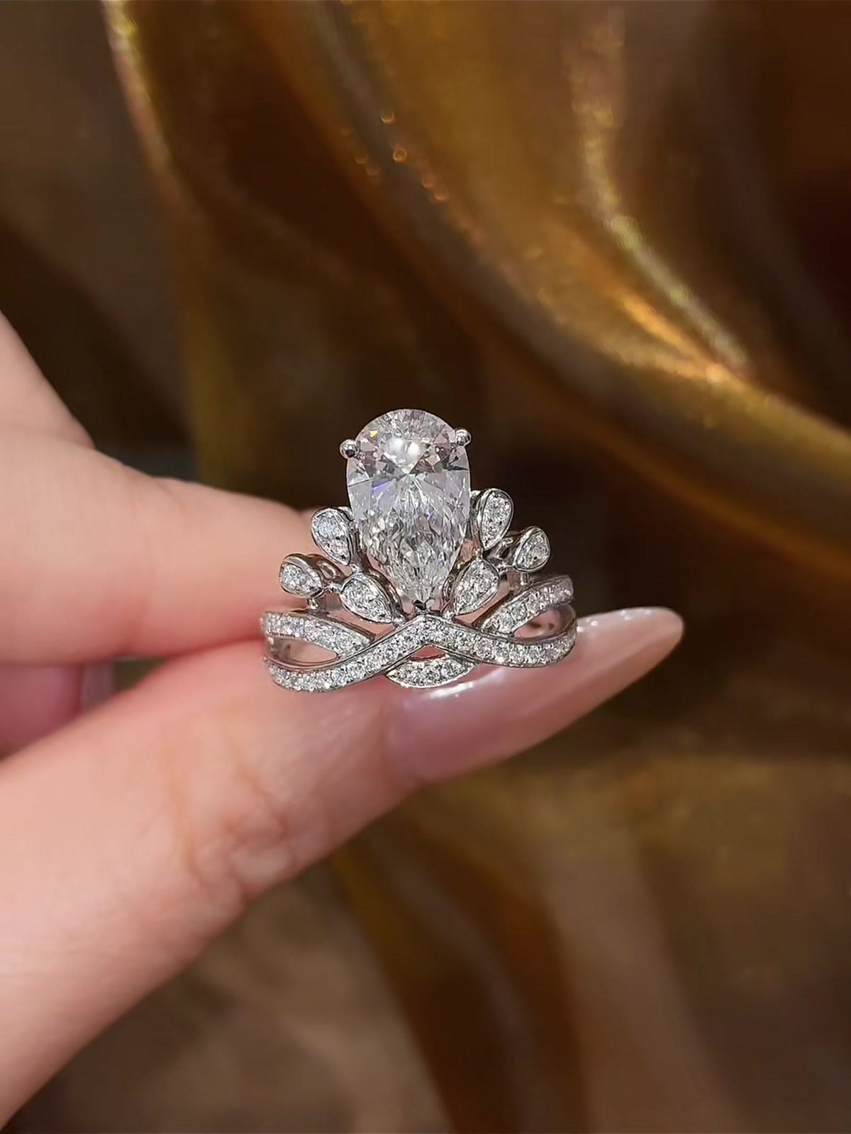 Front view of lab-grown diamond pear crown engagement ring for fairytale proposals