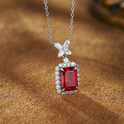 Front view of lab-grown ruby bow pendant necklace in 16K gold for romantic gifts