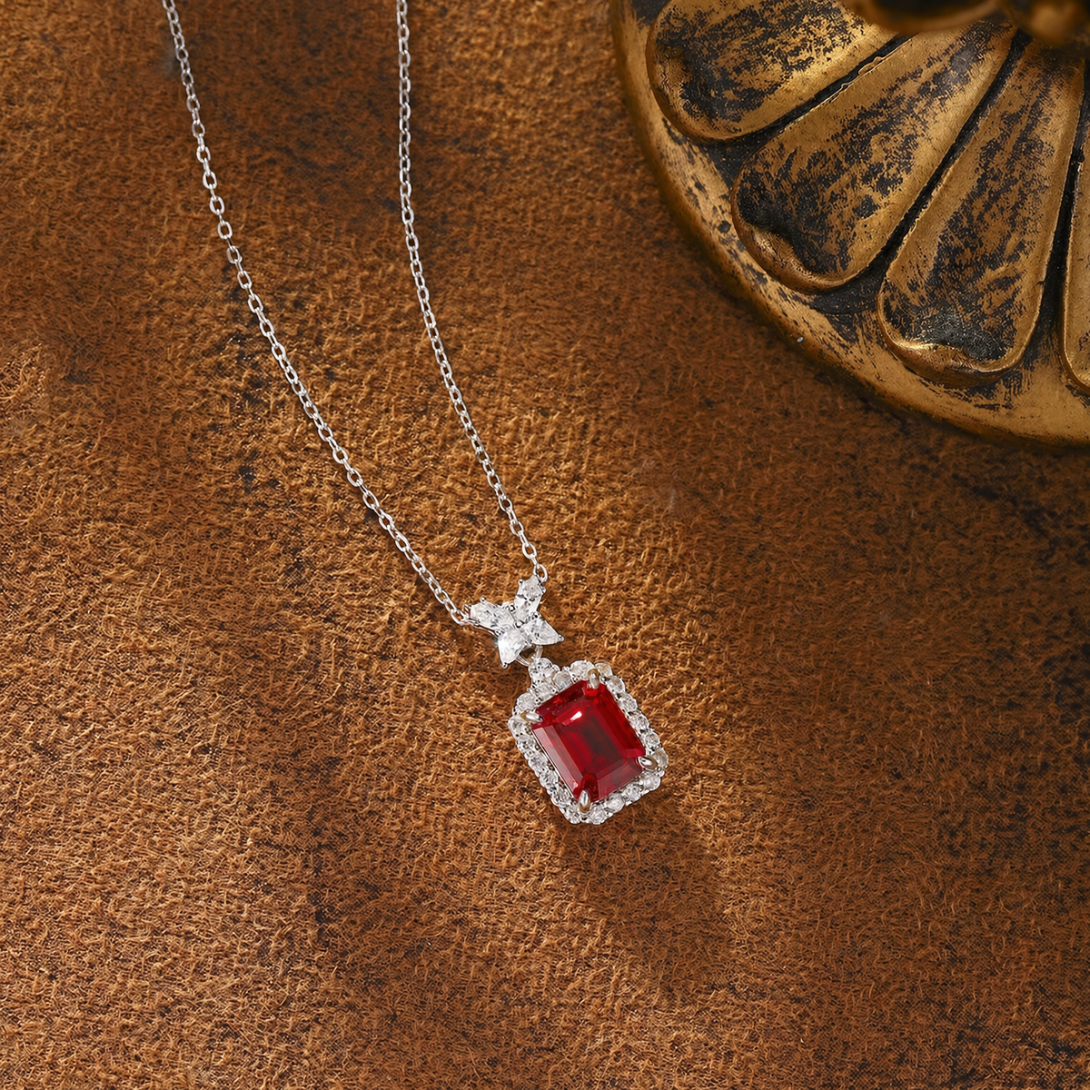 Styled view of lab-grown ruby bow pendant necklace in 16K gold for romantic gifts