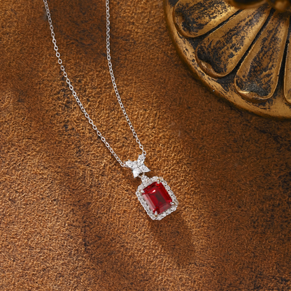 Styled view of lab-grown ruby bow pendant necklace in 16K gold for romantic gifts