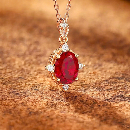 Front view of oval lab-grown ruby pendant necklace in 16K gold for anniversary gifts