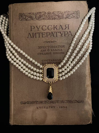 Styled view of vintage cameo high-lustre freshwater pearl necklace for weddings
