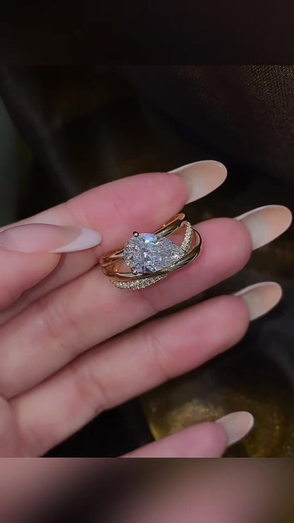 Close-up of lab-grown diamond pear stacking engagement ring for stylish proposals