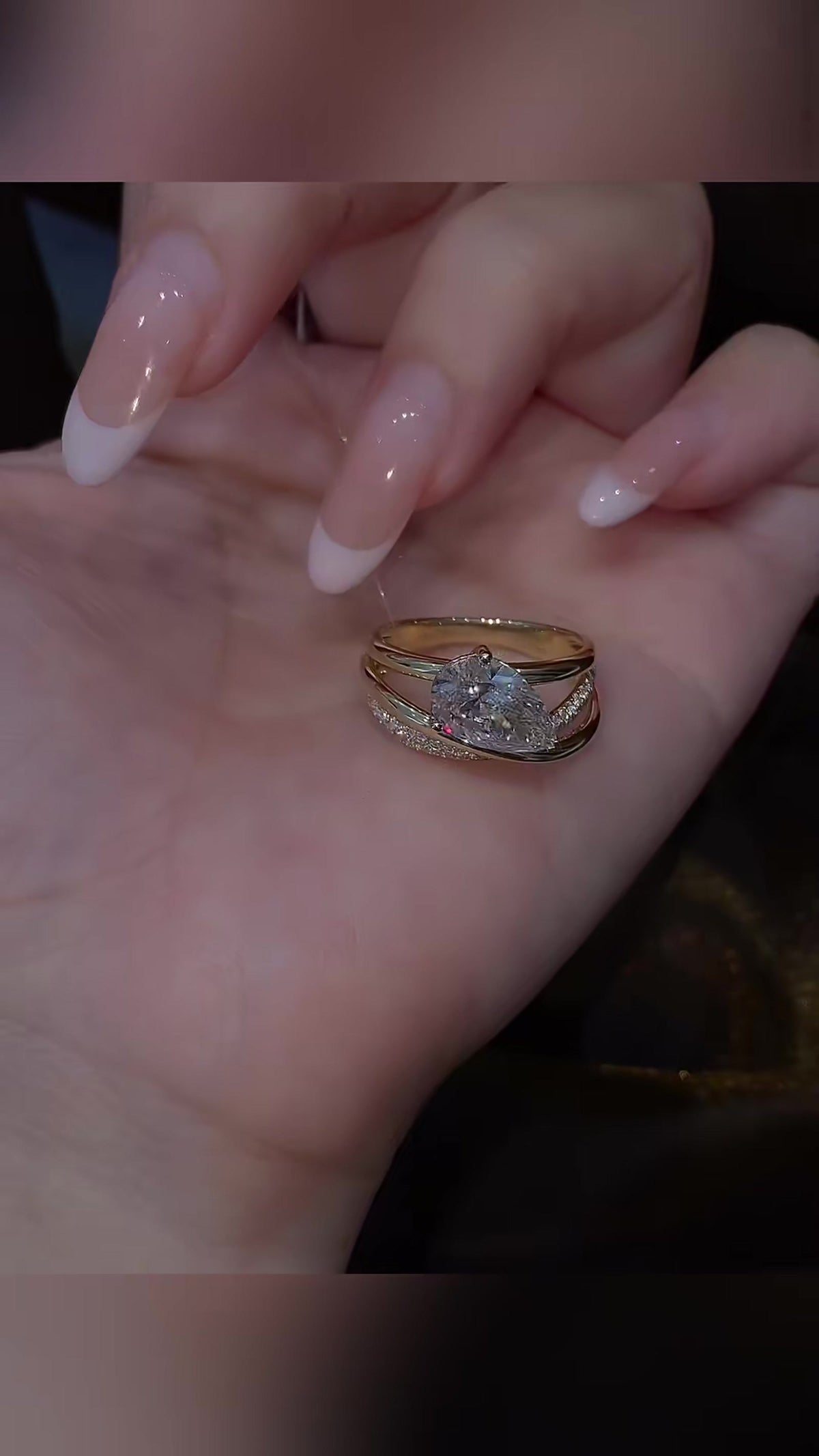 Styled view of lab-grown diamond pear stacking engagement ring for stylish proposals