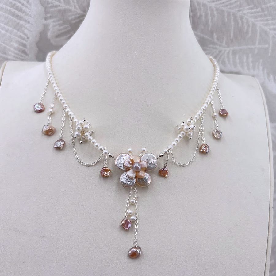 Front view of Rosé Baroque Pearl Garden Necklace, a natural freshwater baroque pearl necklace for garden weddings