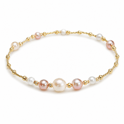 Roselle freshwater pearl station bracelet in 14K gold on a white background