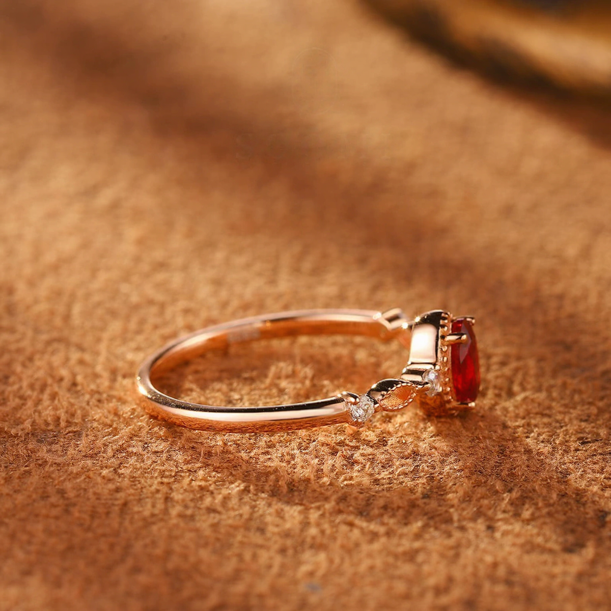 Close-up of oval lab-grown ruby vine ring in 16K gold and S925 sterling silver for romantic gifts