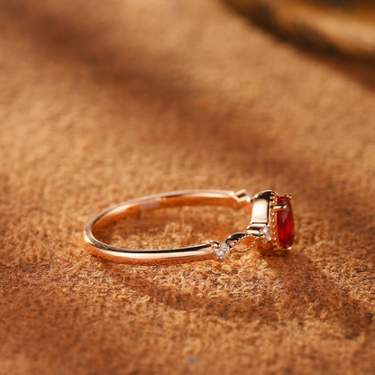Close-up of oval lab-grown ruby vine ring in 16K gold and S925 sterling silver for romantic gifts