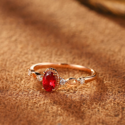Styled view of oval lab-grown ruby vine ring in 16K gold and S925 sterling silver for romantic gifts