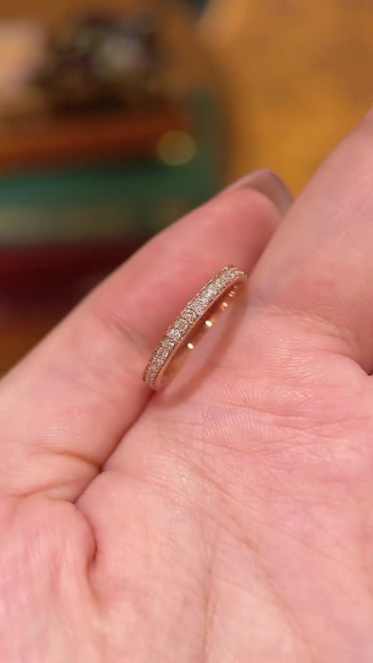 Close-up of lab-grown diamond rose gold pave wedding band for wedding ring stacks