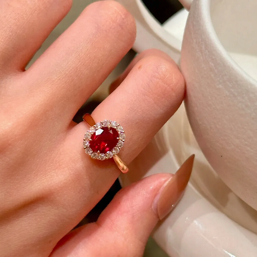 Front view of oval lab-grown ruby halo ring for proposals