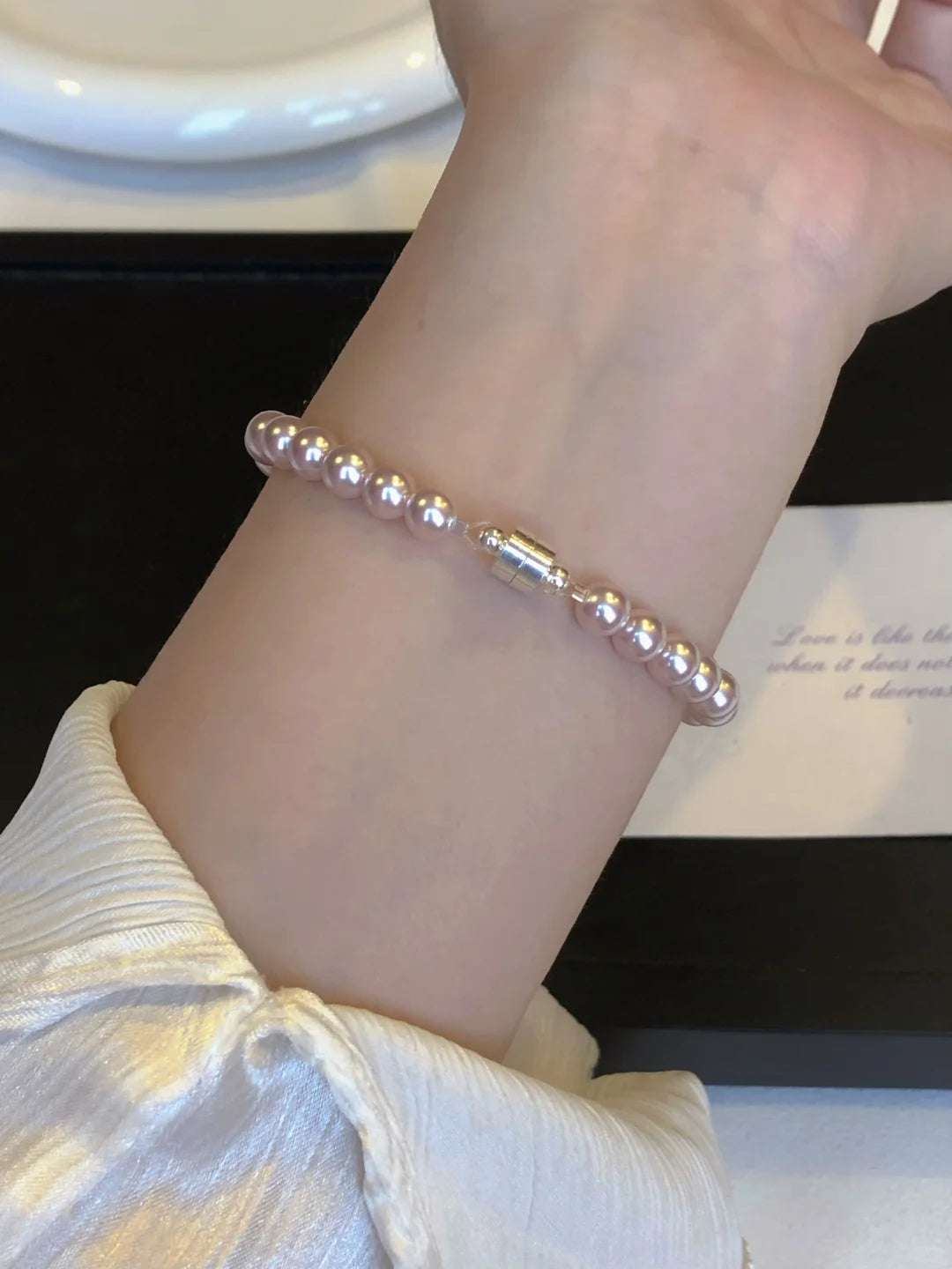 Detail view of pink pearl high-lustre freshwater pearl bracelet for bridal styling