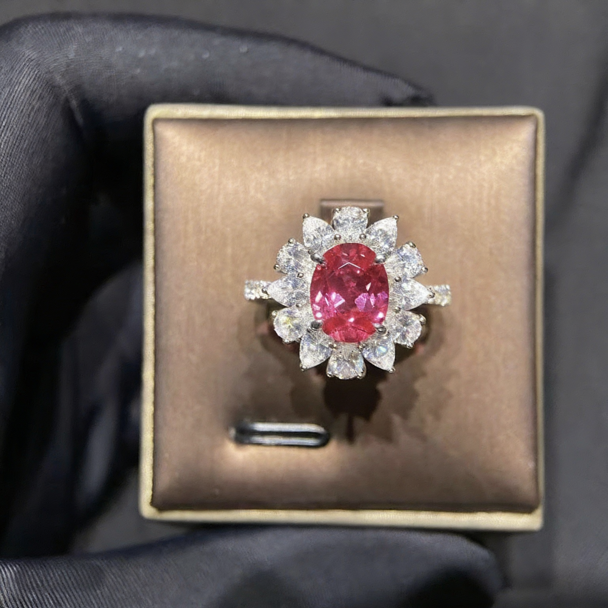 Front view of oval lab-grown ruby floral halo ring for romantic proposals