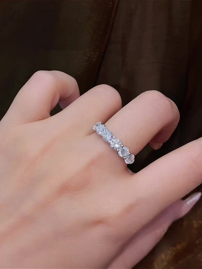 Styled view of lab-grown diamond seven stone anniversary band for wedding stacks
