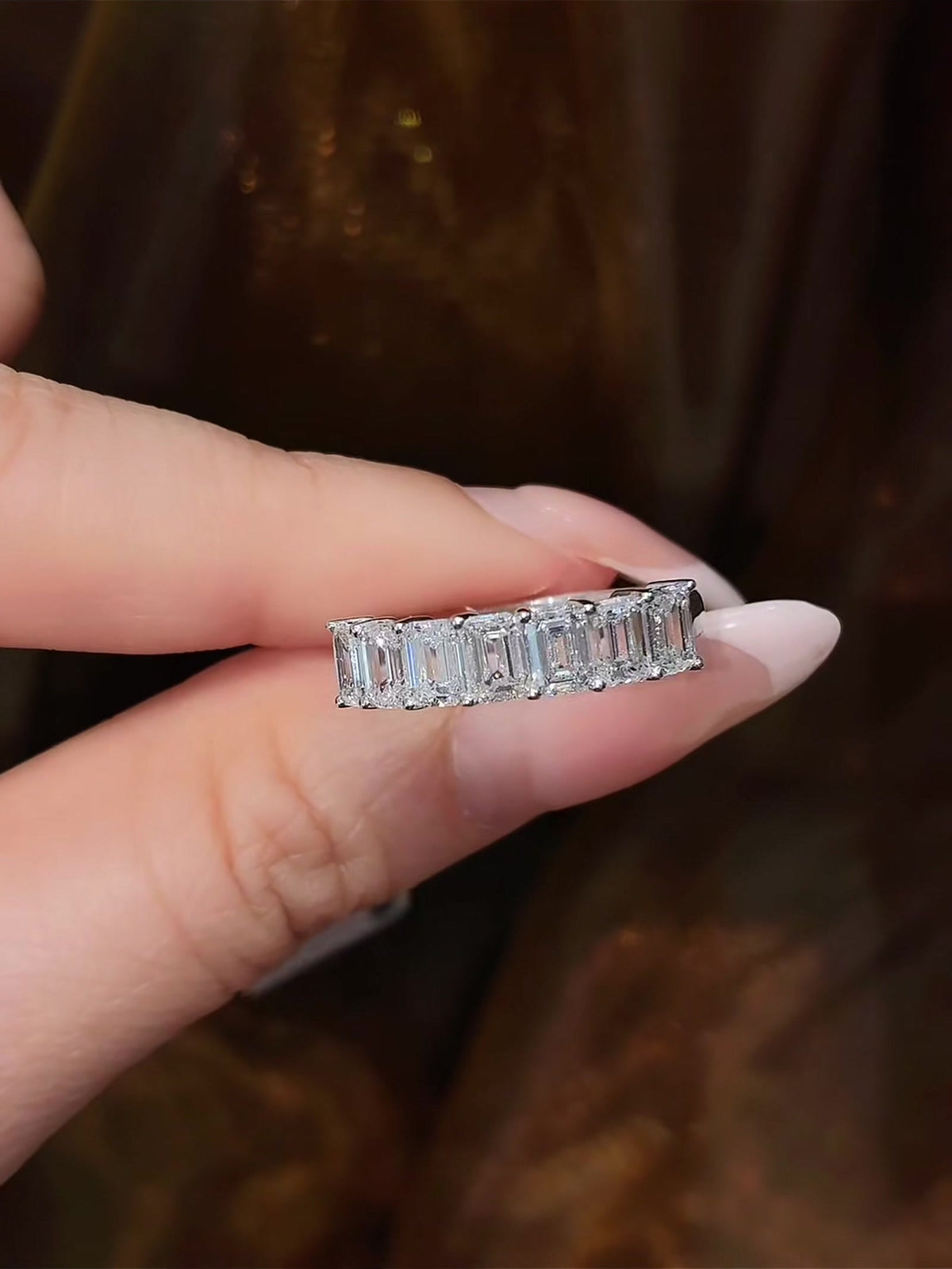 Close-up of lab-grown diamond seven stone anniversary band for wedding stacks