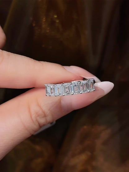 Close-up of lab-grown diamond seven stone anniversary band for wedding stacks