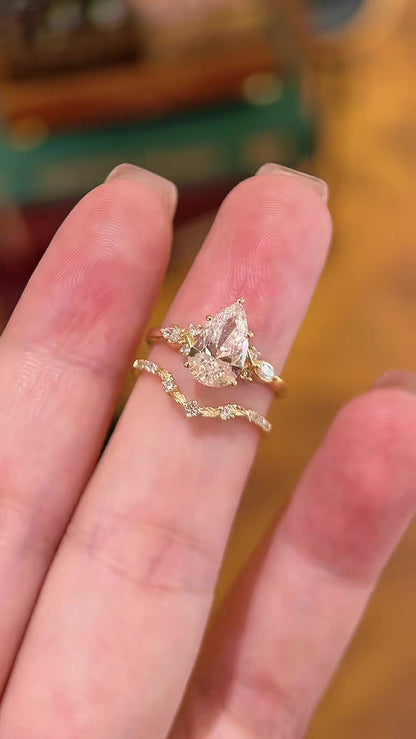 Styled view of lab-grown diamond pear bridal stacking ring for bridal ring stacks