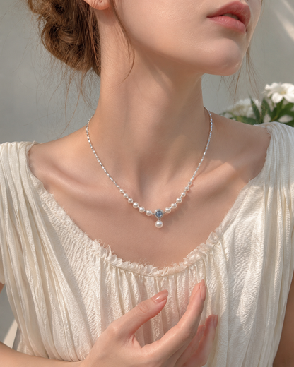 Freshwater pearl aquamarine necklace styled with an elegant cream outfit