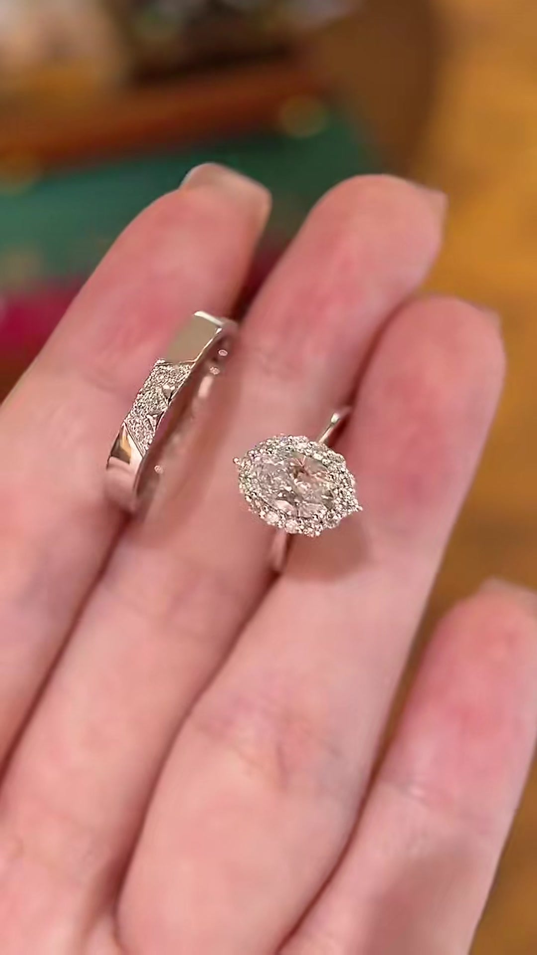 Front view of lab-grown diamond oval halo bridal ring set for engagement proposals