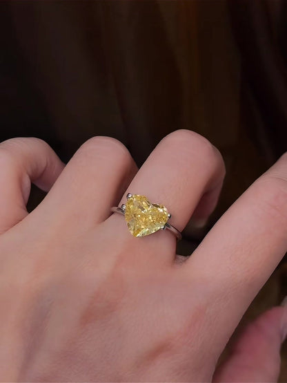 Close-up of lab-grown yellow diamond heart engagement ring for bold proposals