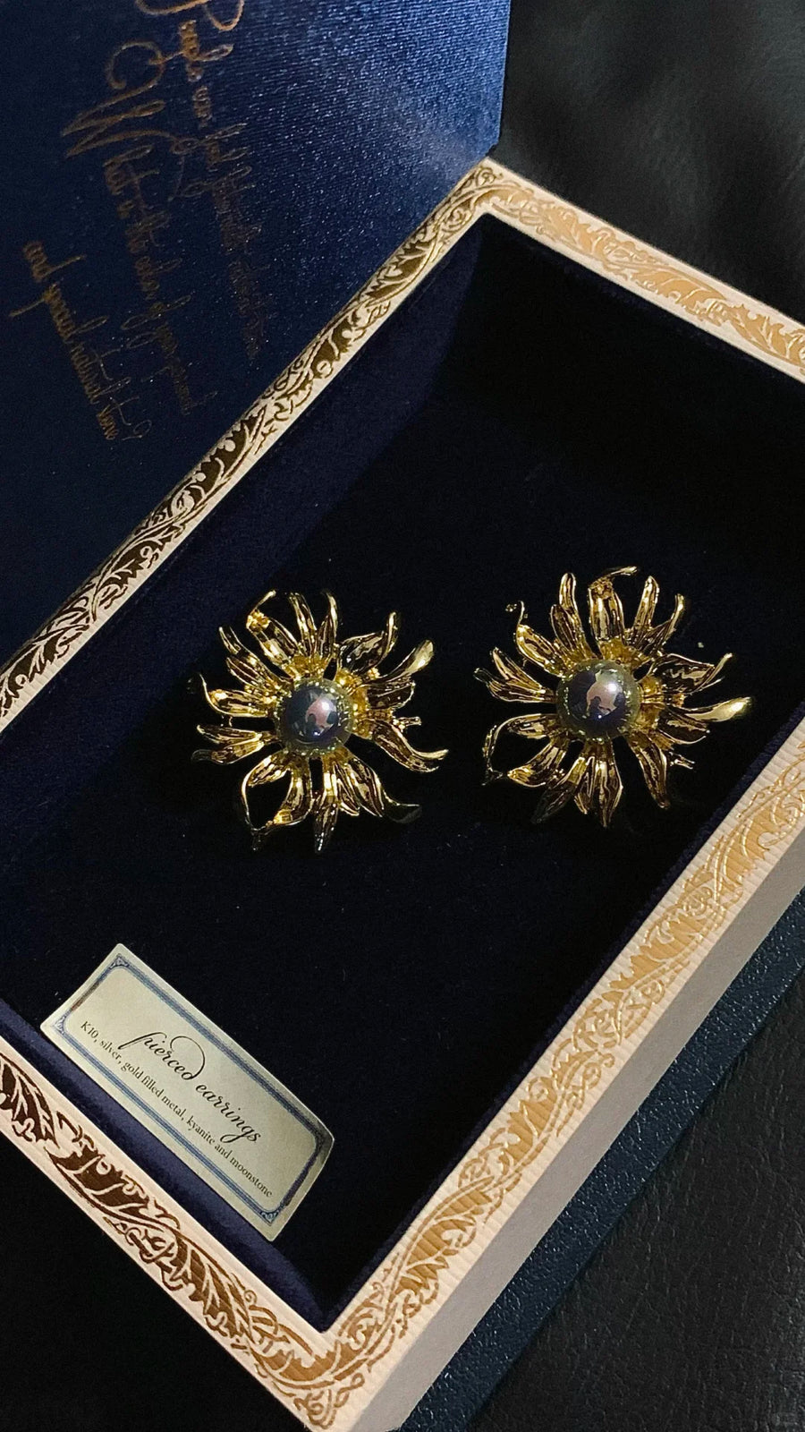 Styled view of sunburst high-lustre freshwater pearl earrings for wedding guest looks