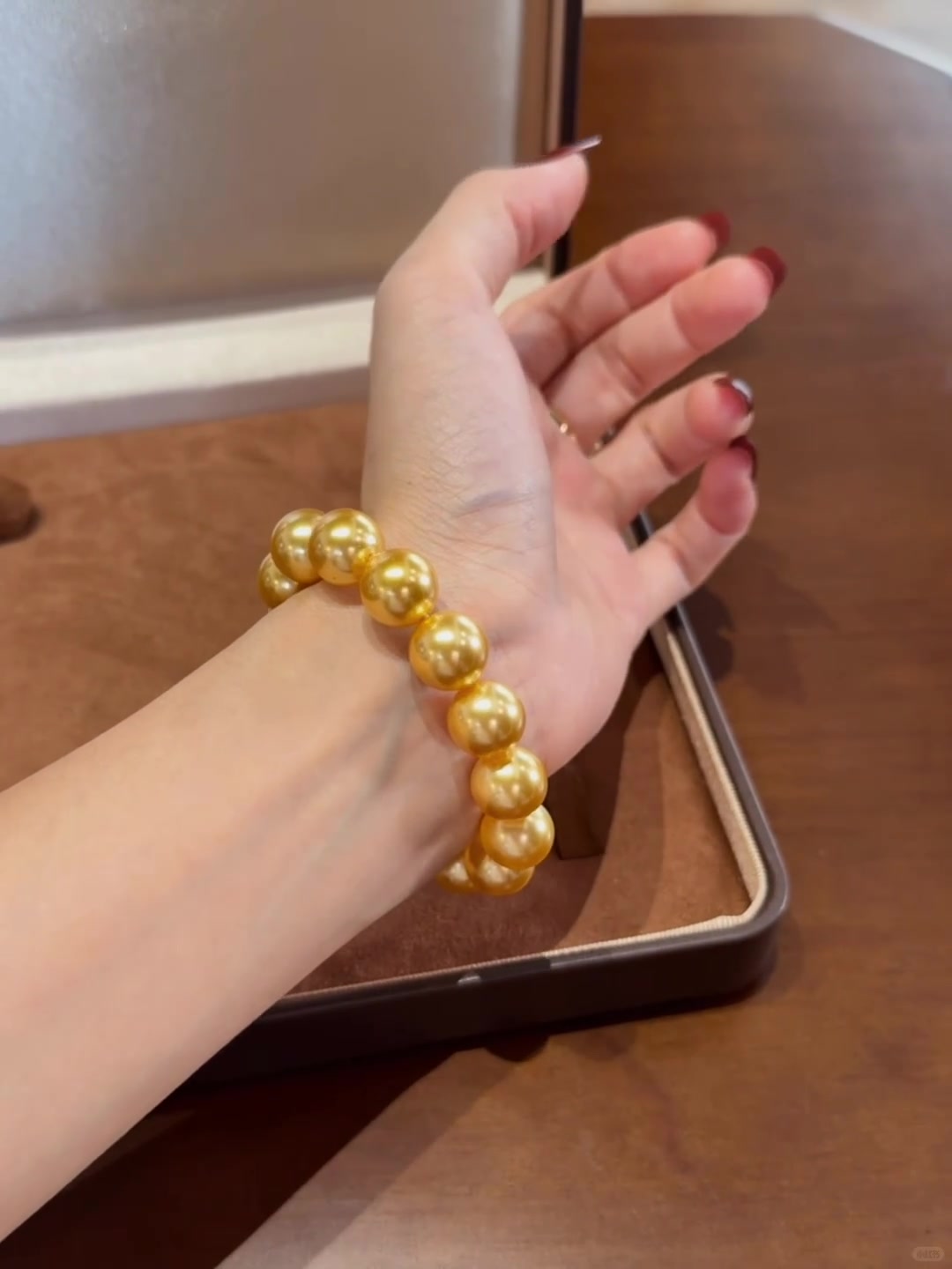 Styled view of golden high-lustre freshwater pearl bracelet for bridal styling
