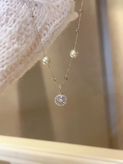 Front view of compass pendant high-lustre freshwater pearl necklace for weddings