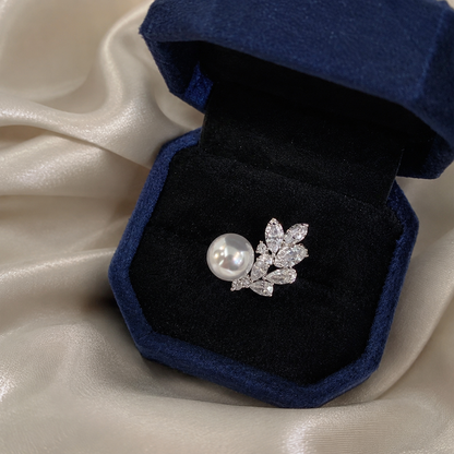 Akoya pearl and sterling silver leaf ring in a navy jewellery box