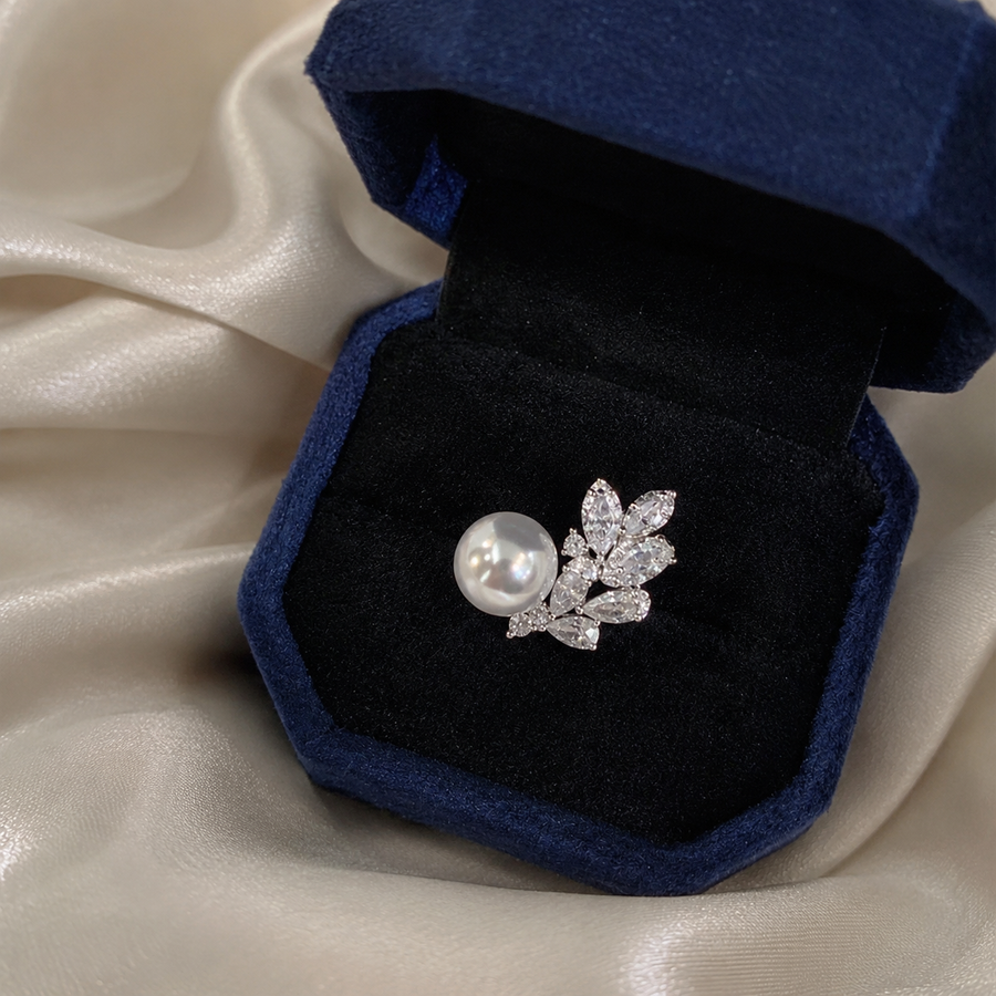 Akoya pearl and sterling silver leaf ring in a navy jewellery box