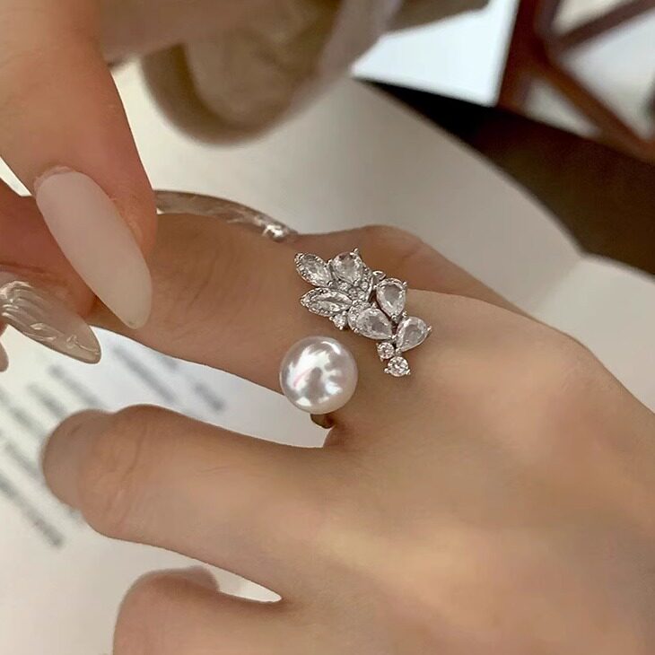 Detailed side view of a 10–12mm Akoya pearl open ring