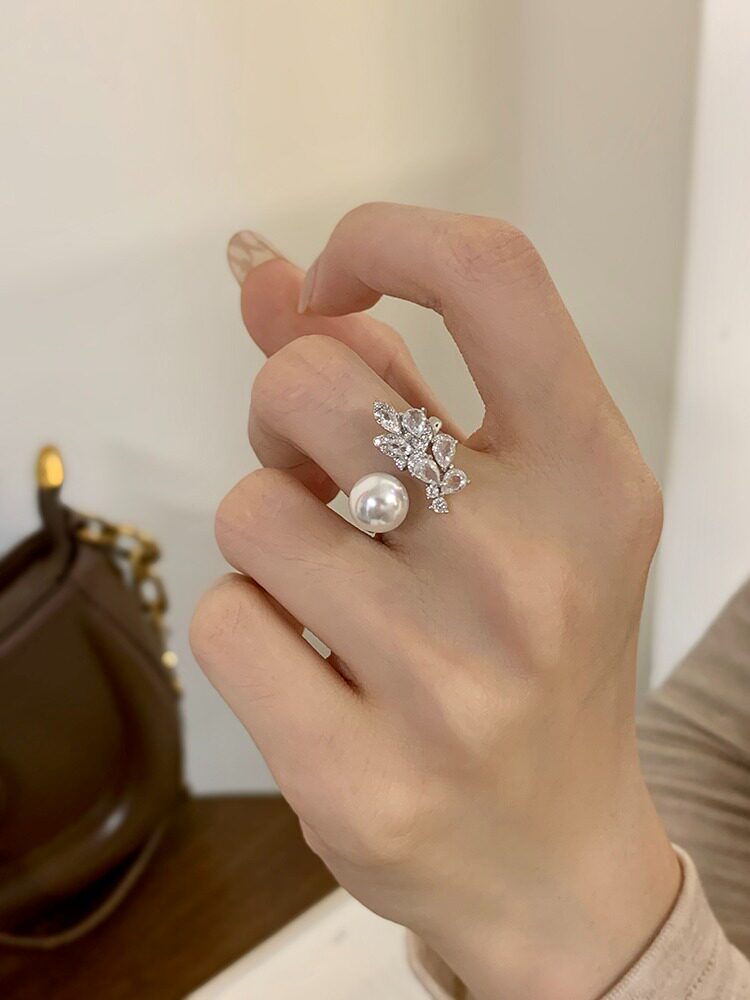 Close view of an adjustable Akoya pearl leaf ring