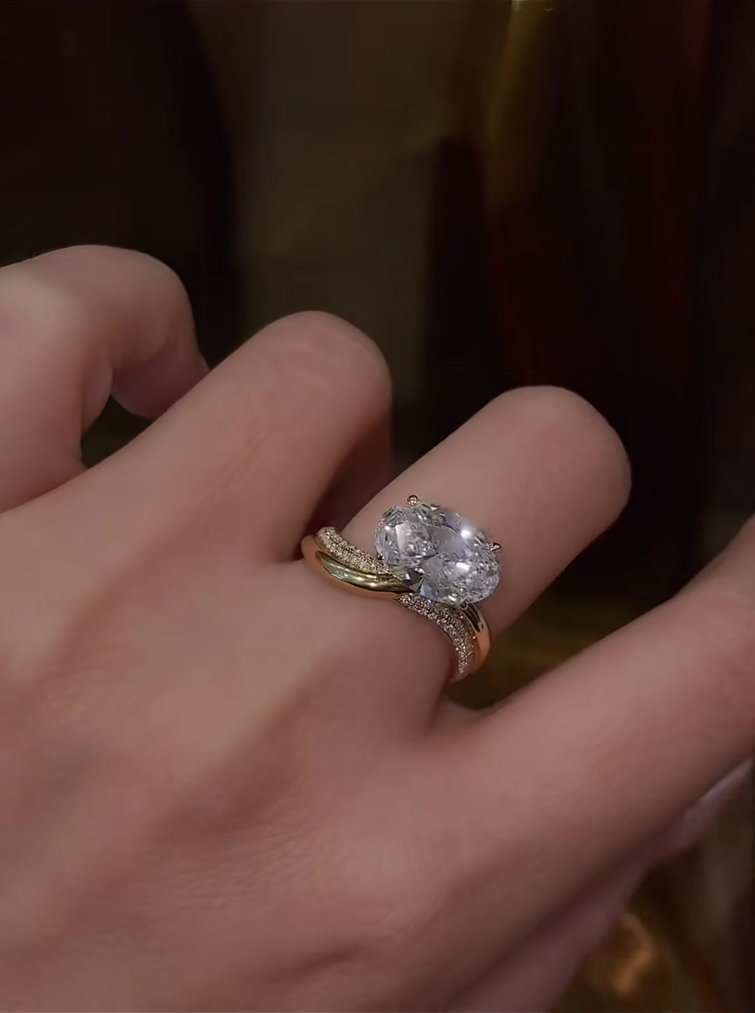 Close-up of lab-grown diamond oval twist engagement ring for modern proposals