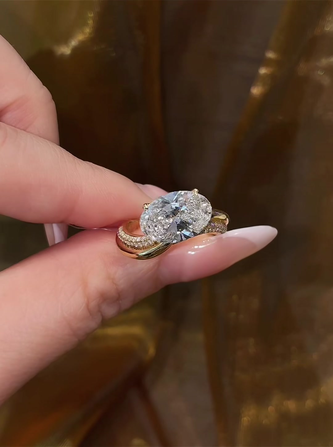 Front view of lab-grown diamond oval twist engagement ring for modern proposals
