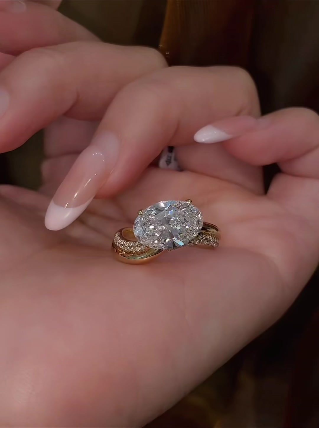 Styled view of lab-grown diamond oval twist engagement ring for modern proposals