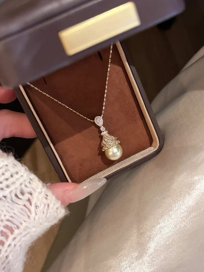 Styled view of four-leaf clover high-lustre freshwater pearl necklace for weddings