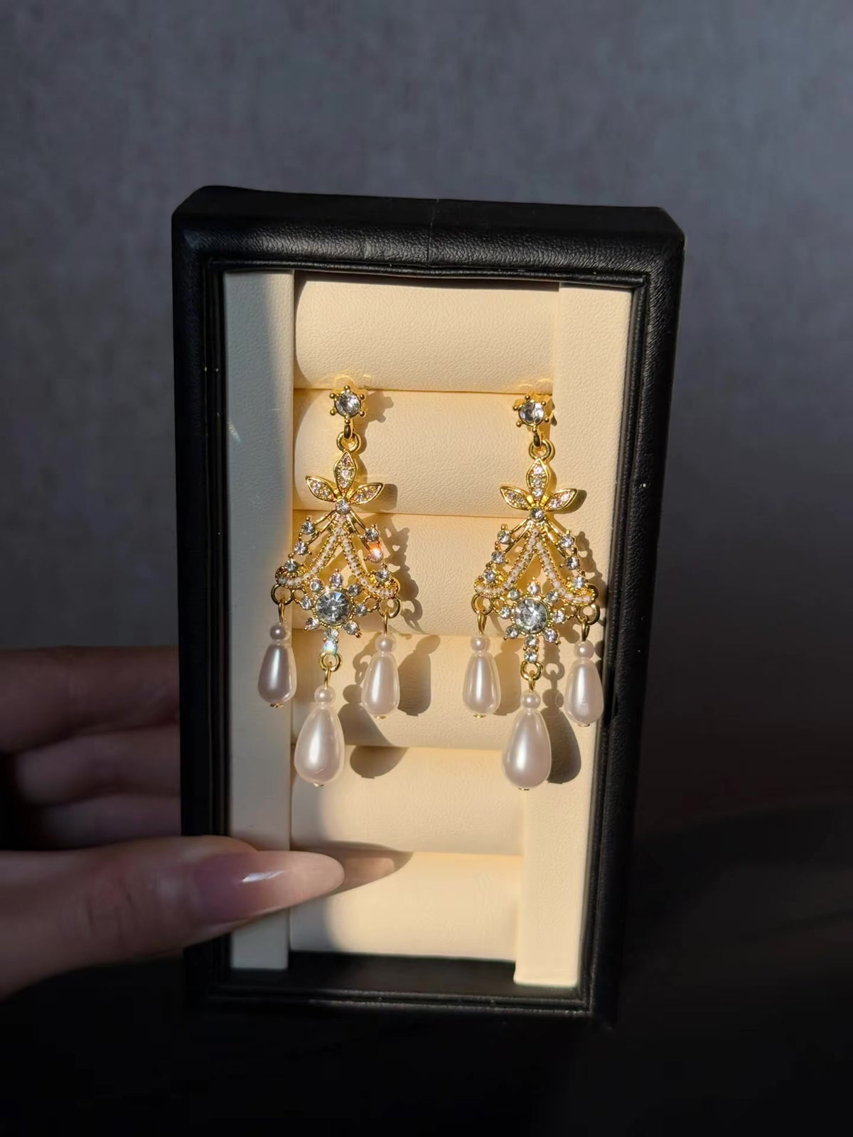 Front view of court statement high-lustre freshwater pearl earrings for wedding guest looks
