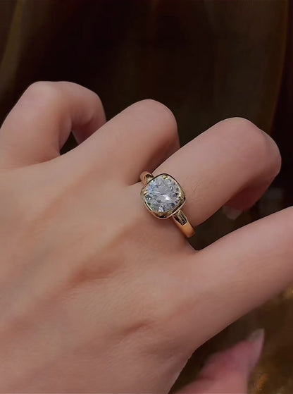 Close-up of lab-grown diamond cushion bezel engagement ring for modern proposals