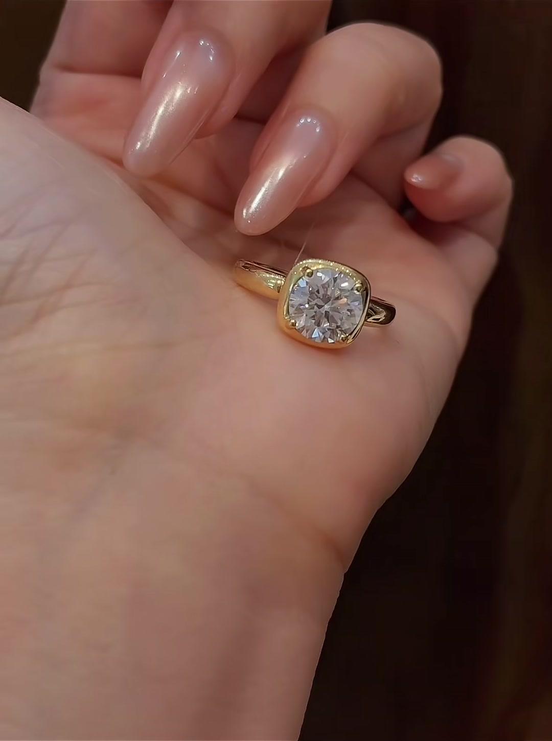 Styled view of lab-grown diamond cushion bezel engagement ring for modern proposals