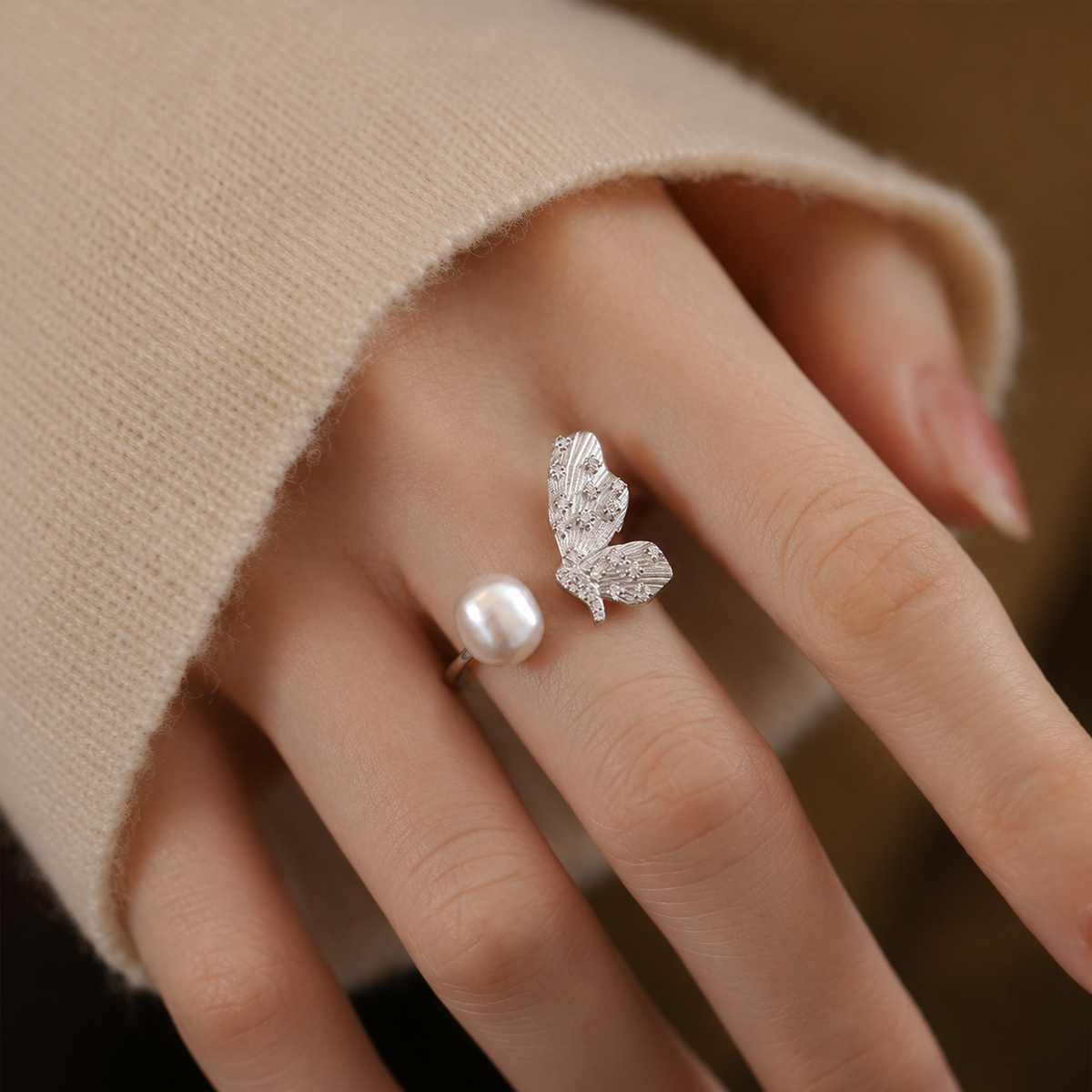 Freshwater pearl and butterfly open ring worn on the hand